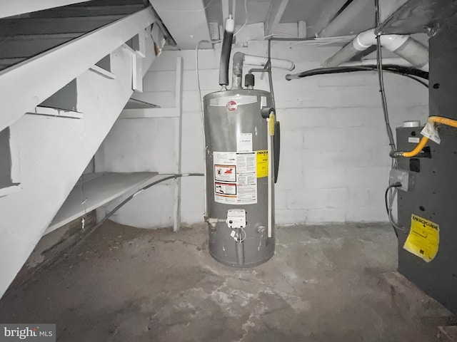 utility room featuring gas water heater