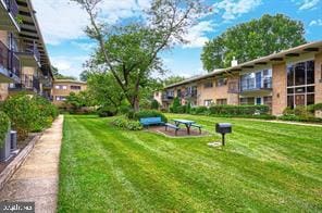 view of community featuring a lawn