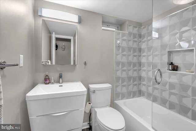 full bathroom with toilet, tiled shower / bath combo, and vanity