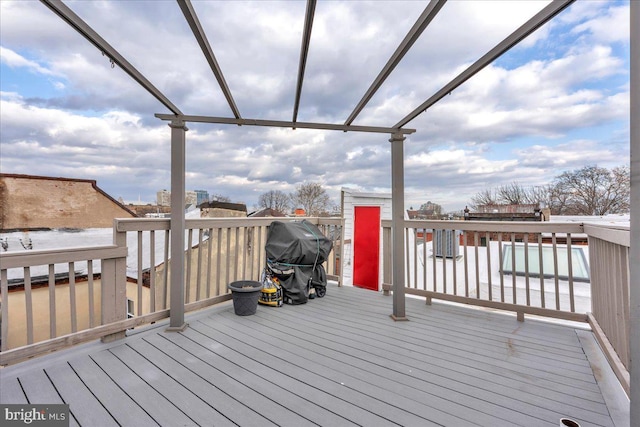 wooden deck featuring area for grilling