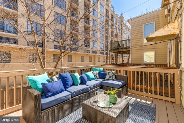 wooden terrace featuring an outdoor hangout area