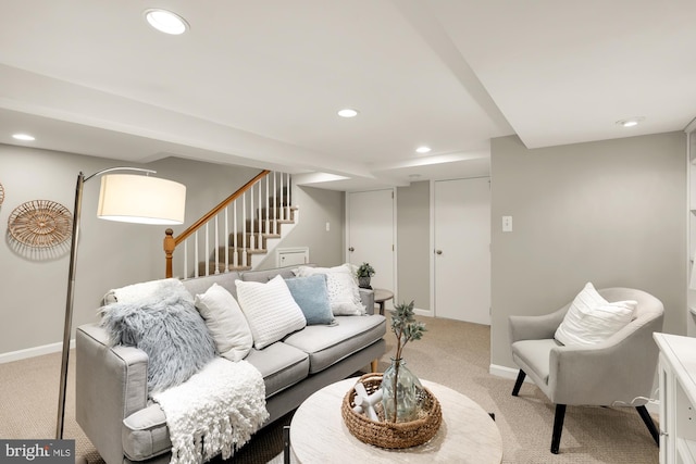 living area featuring light carpet, stairs, baseboards, and recessed lighting