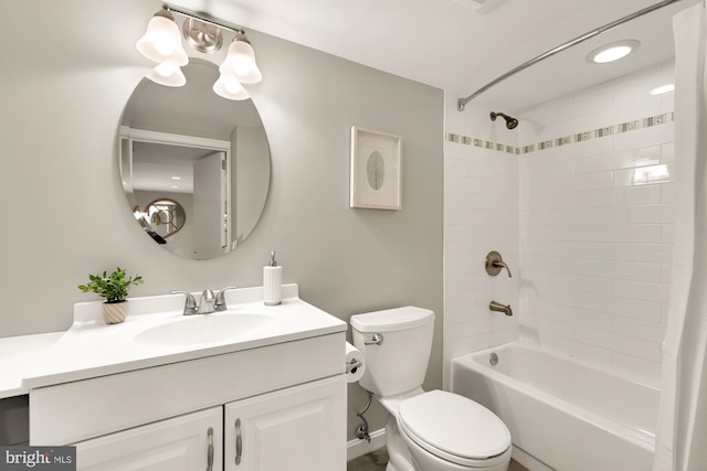 bathroom featuring toilet, shower / tub combo with curtain, and vanity