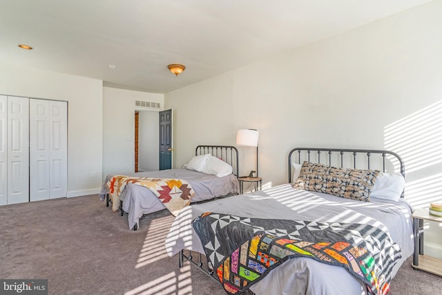 bedroom with a closet and carpet