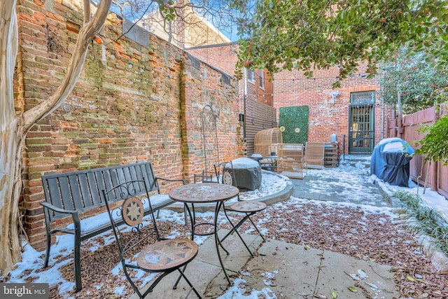 view of snow covered patio