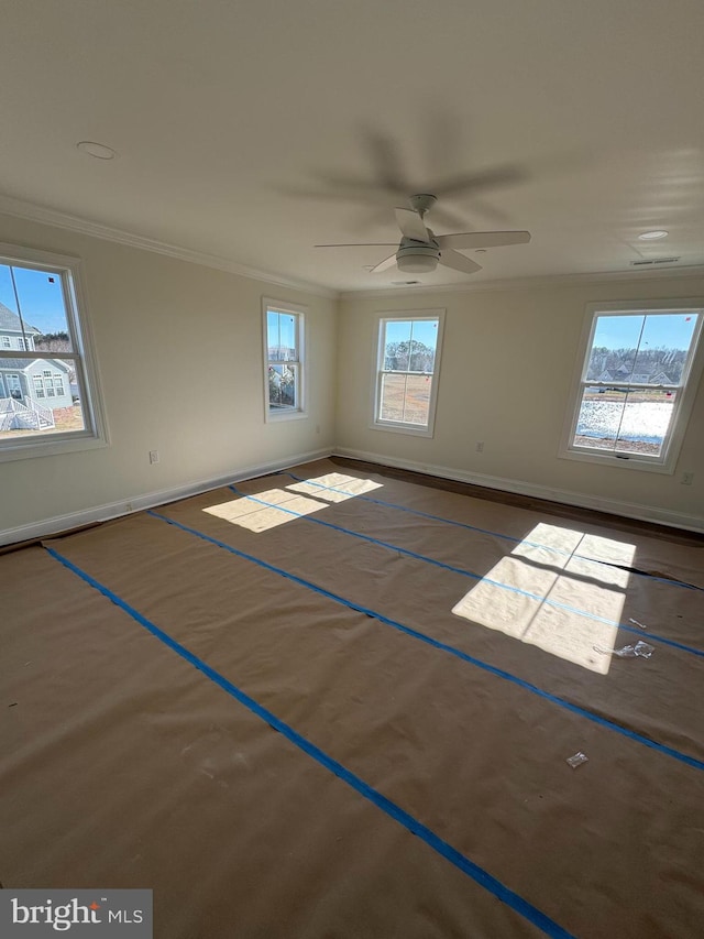 unfurnished room featuring crown molding