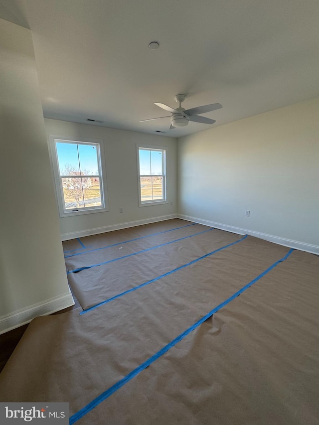 unfurnished room featuring ceiling fan