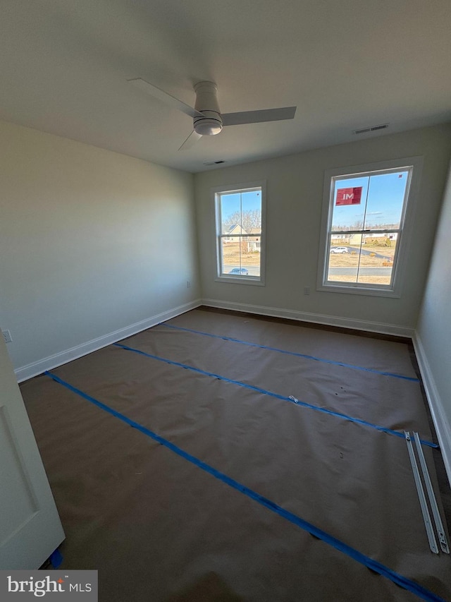 unfurnished room with ceiling fan