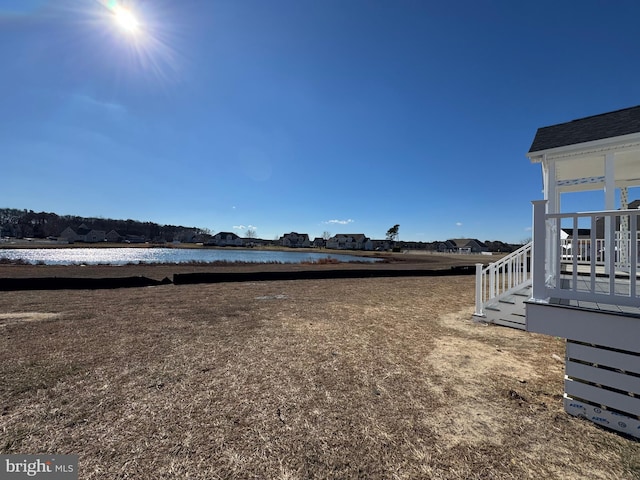 view of yard with a water view