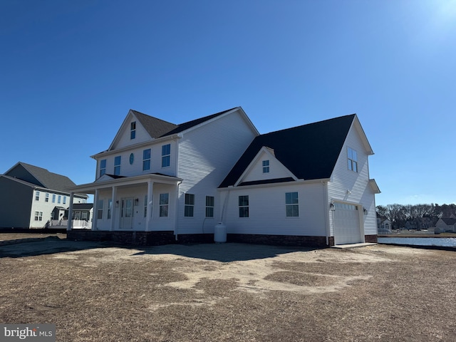 view of front of house featuring a garage and covered porch