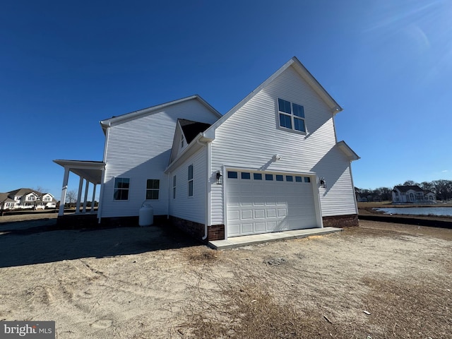 view of side of property featuring a garage