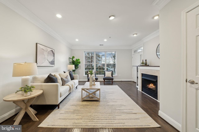 living room featuring dark hardwood / wood-style flooring and ornamental molding