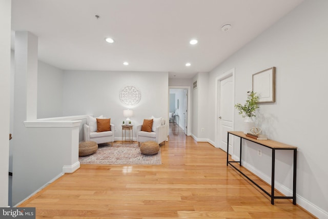 sitting room with light hardwood / wood-style flooring