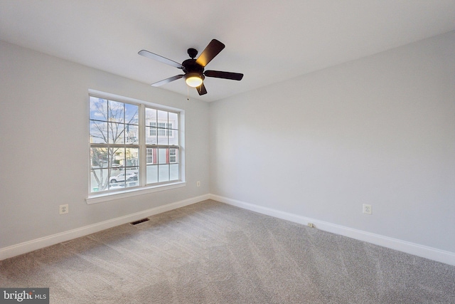 carpeted empty room with ceiling fan