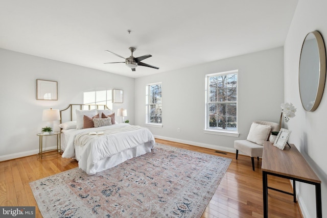 bedroom featuring light hardwood / wood-style flooring and ceiling fan