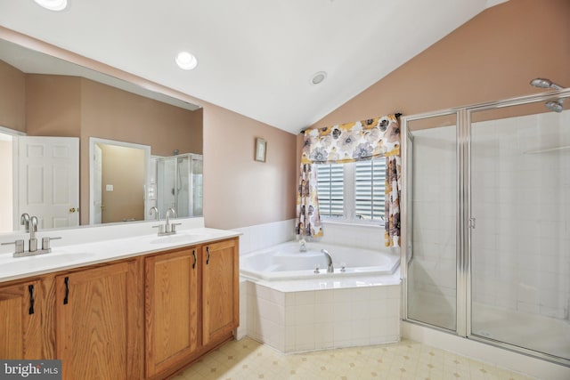 bathroom with vaulted ceiling, plus walk in shower, and vanity