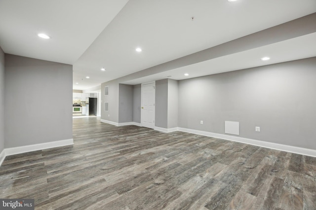 basement with hardwood / wood-style floors