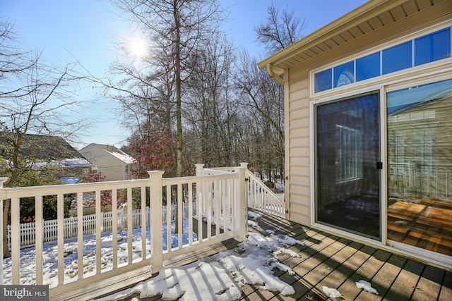 view of snow covered deck