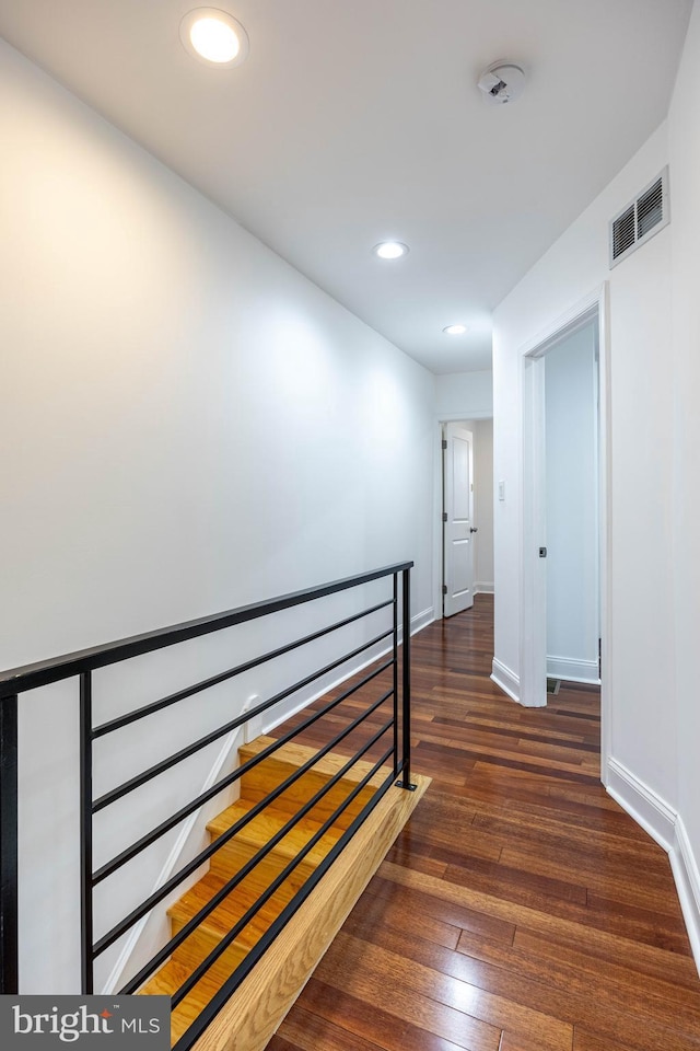 hallway featuring dark wood-type flooring