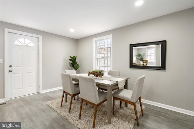 dining area featuring hardwood / wood-style flooring