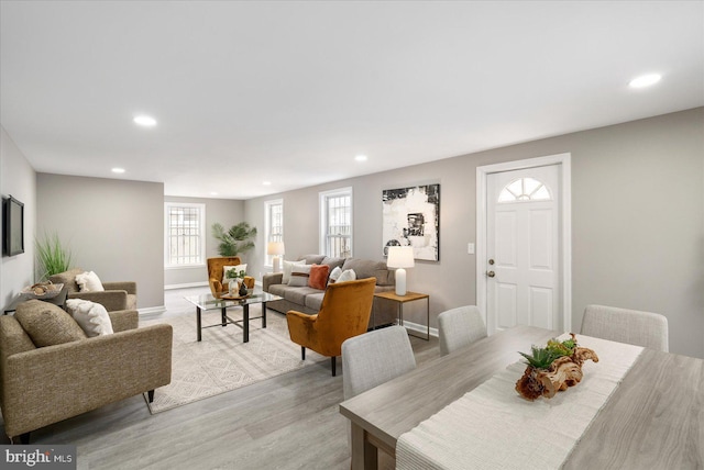 dining space with light hardwood / wood-style floors