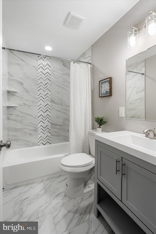 full bathroom with shower / bath combo with shower curtain, toilet, and vanity