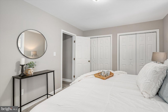 bedroom with multiple closets