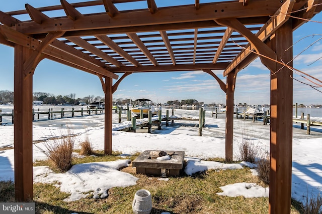 exterior space featuring a fire pit and a pergola