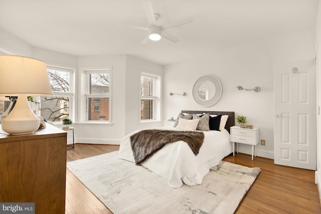 bedroom featuring ceiling fan and light hardwood / wood-style flooring