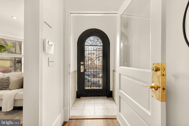 entryway featuring light hardwood / wood-style floors and a healthy amount of sunlight