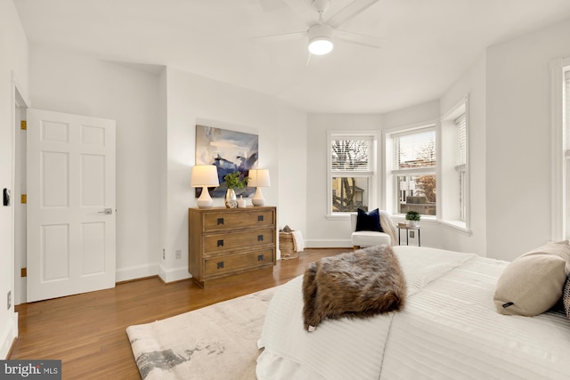 bedroom featuring wood-type flooring and ceiling fan