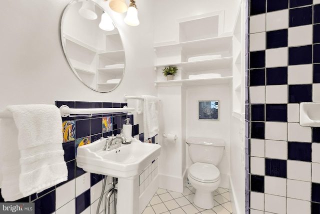 bathroom with tile patterned floors and toilet