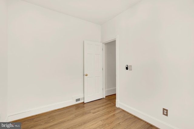 unfurnished room featuring light hardwood / wood-style floors