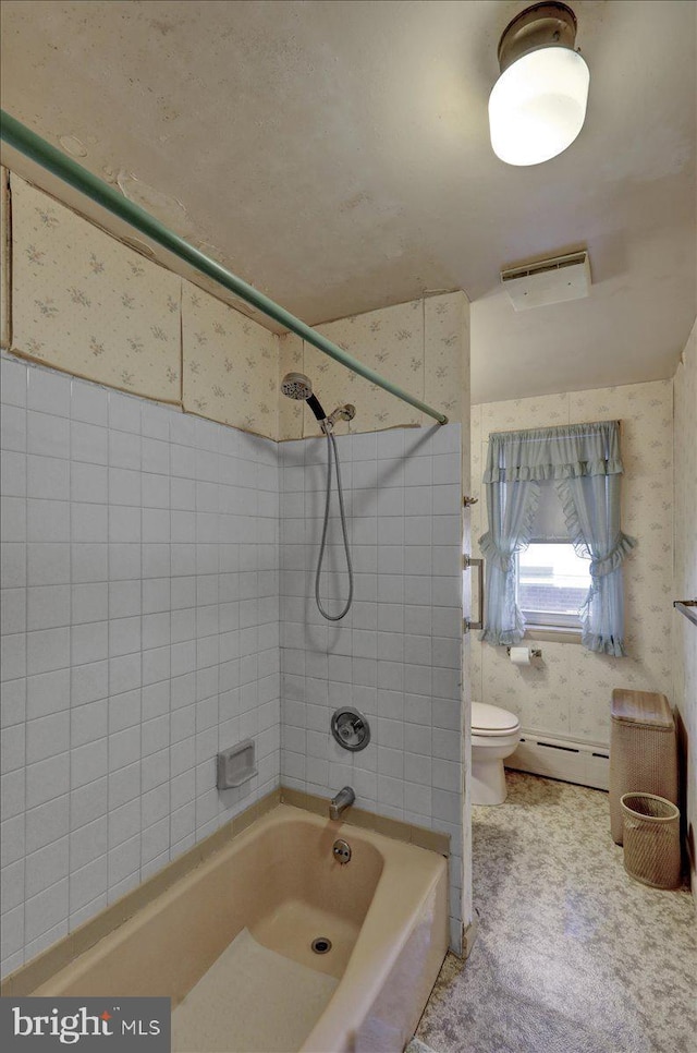 full bathroom featuring  shower combination, wallpapered walls, a baseboard heating unit, and toilet