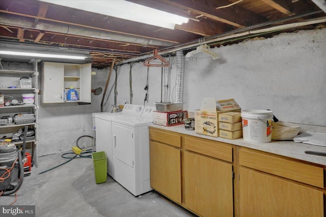 clothes washing area featuring laundry area and washing machine and clothes dryer