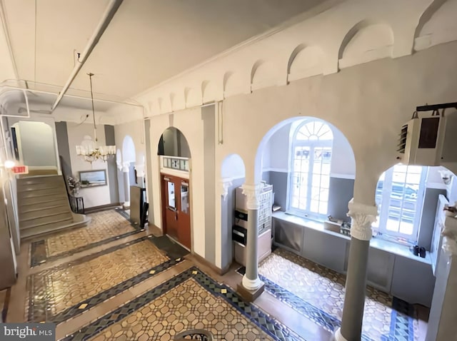 foyer featuring an inviting chandelier