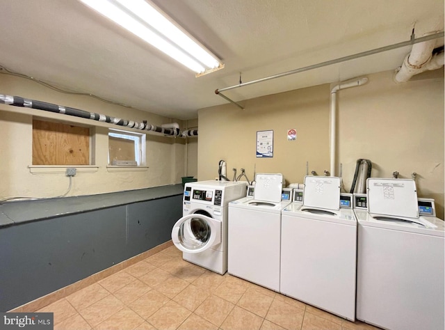 clothes washing area featuring washing machine and clothes dryer