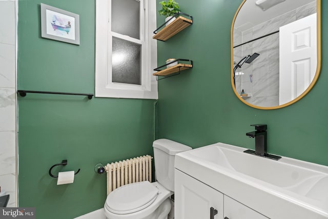 bathroom featuring a shower, vanity, toilet, and radiator