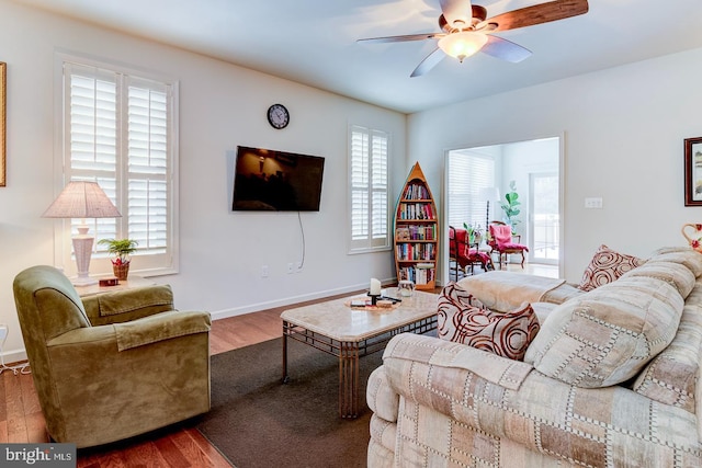 living room with ceiling fan, a healthy amount of sunlight, and hardwood / wood-style flooring