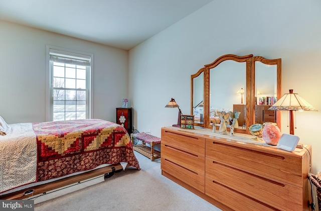 bedroom featuring light colored carpet