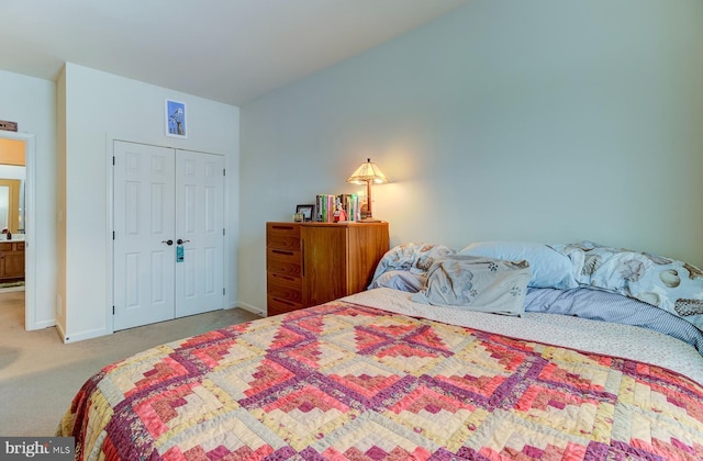 bedroom with carpet floors and a closet