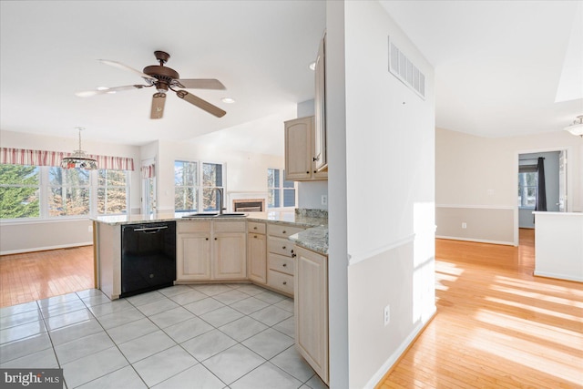 kitchen featuring sink, ceiling fan, dishwasher, and light brown cabinets