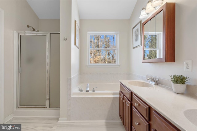 bathroom featuring vanity and separate shower and tub