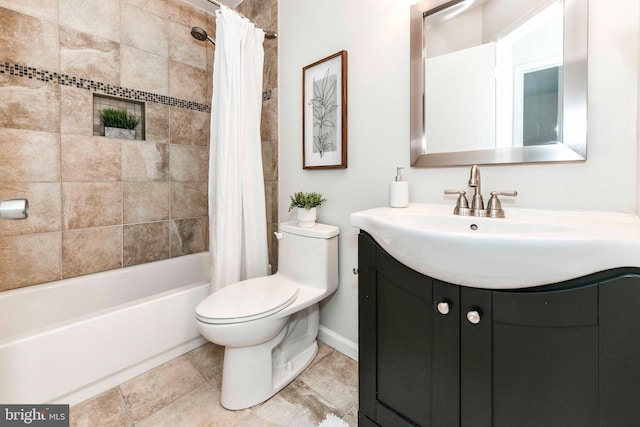 full bathroom featuring shower / bath combo with shower curtain, vanity, and toilet