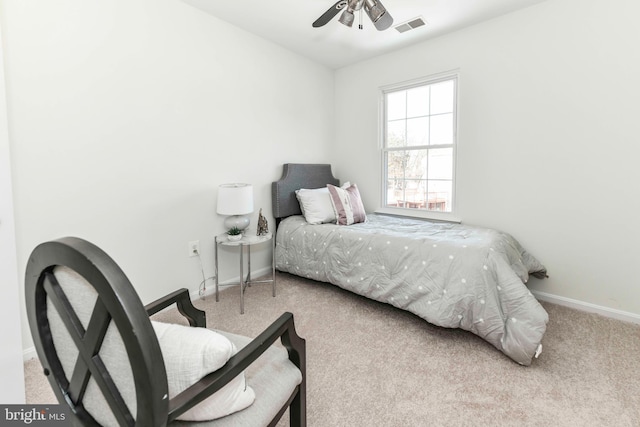 bedroom with light carpet and ceiling fan