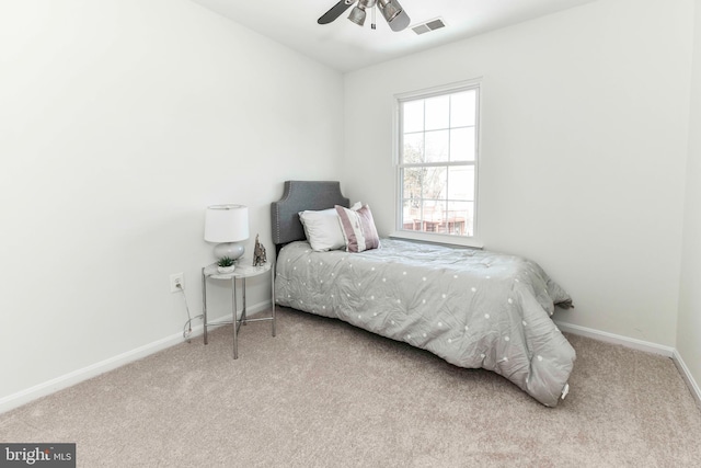 bedroom with light colored carpet and ceiling fan