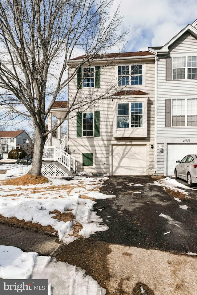 townhome / multi-family property featuring a garage