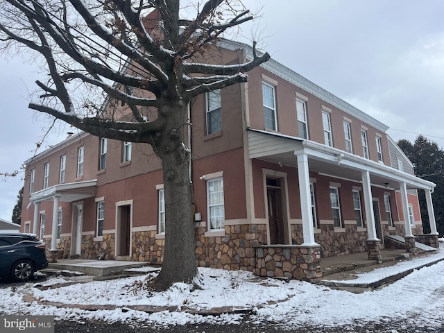 view of snow covered property