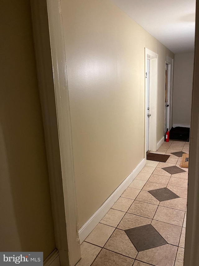 hallway featuring light tile patterned flooring