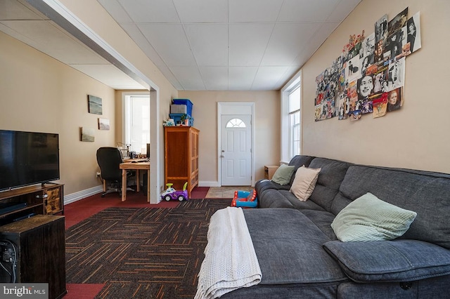 living room featuring dark colored carpet